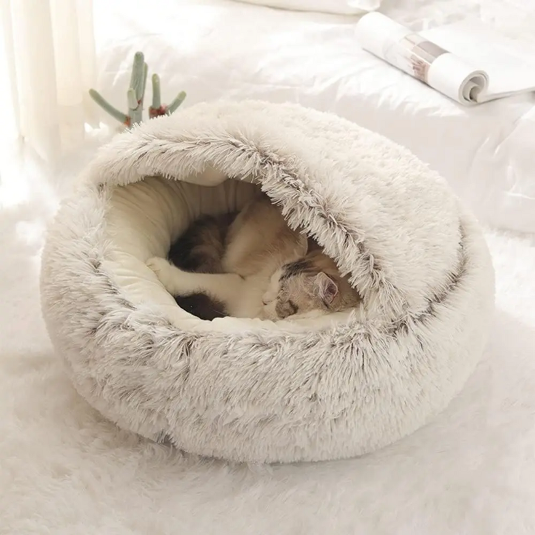 Plush dog bed with a cozy cave, providing ultimate comfort and calming sleep for pets.