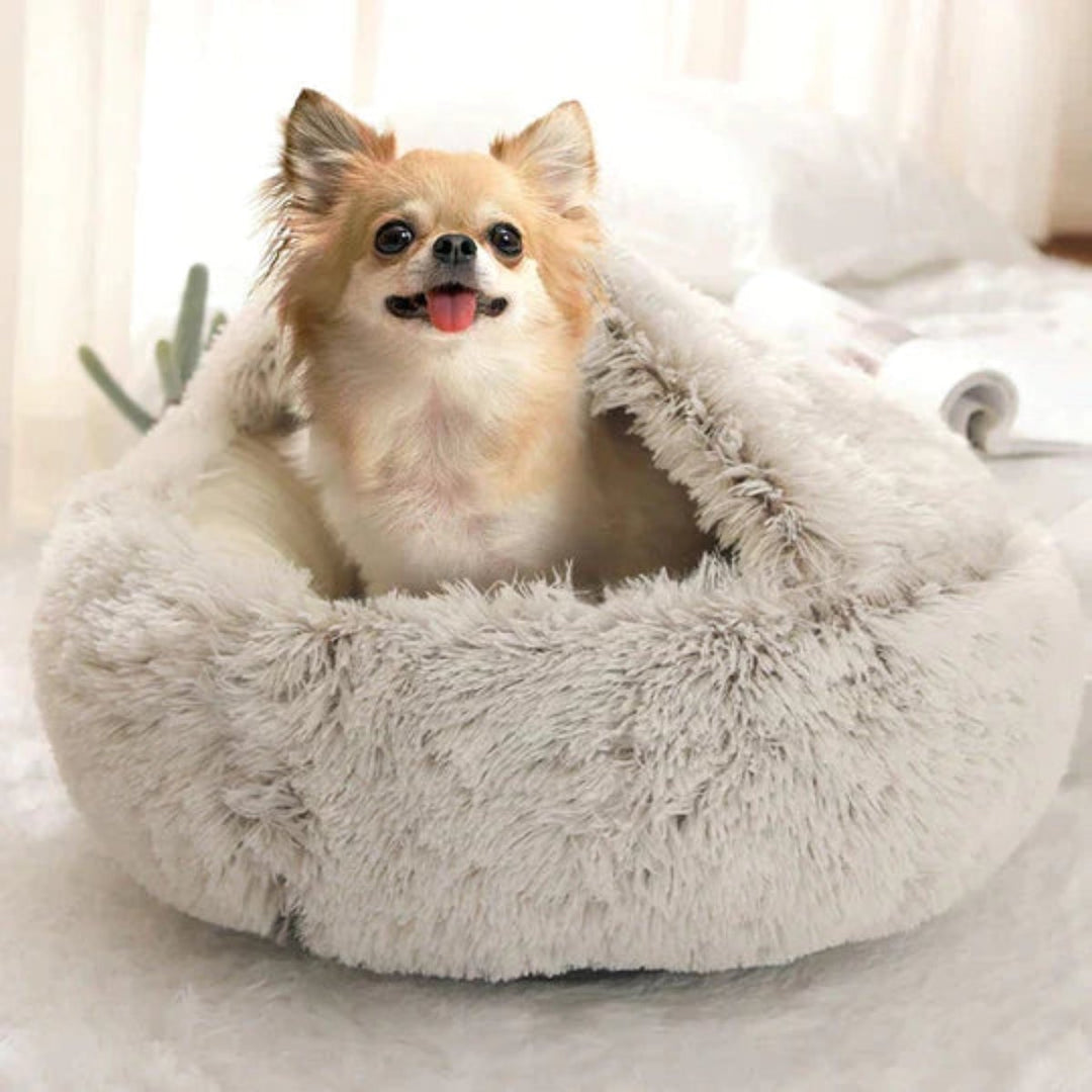 Calming dog bed featuring a cozy cave design, ideal for anxiety relief & deep sleep.