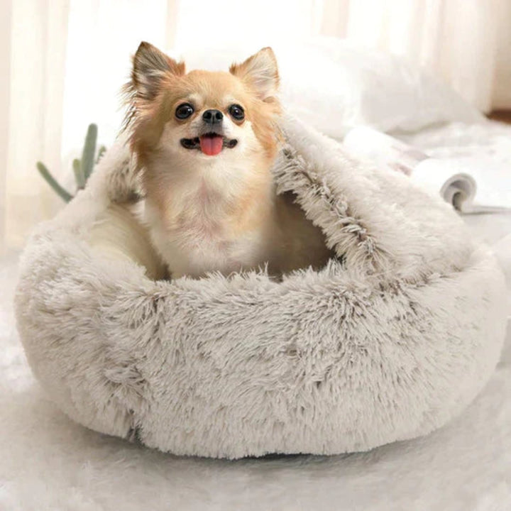 Calming dog bed featuring a cozy cave design, ideal for anxiety relief & deep sleep.