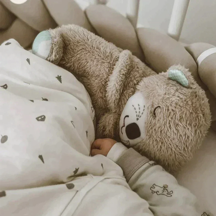 Gentle TranquilOtter plush for baby sleep. Features calming breathing, soft music & comfort for infants.