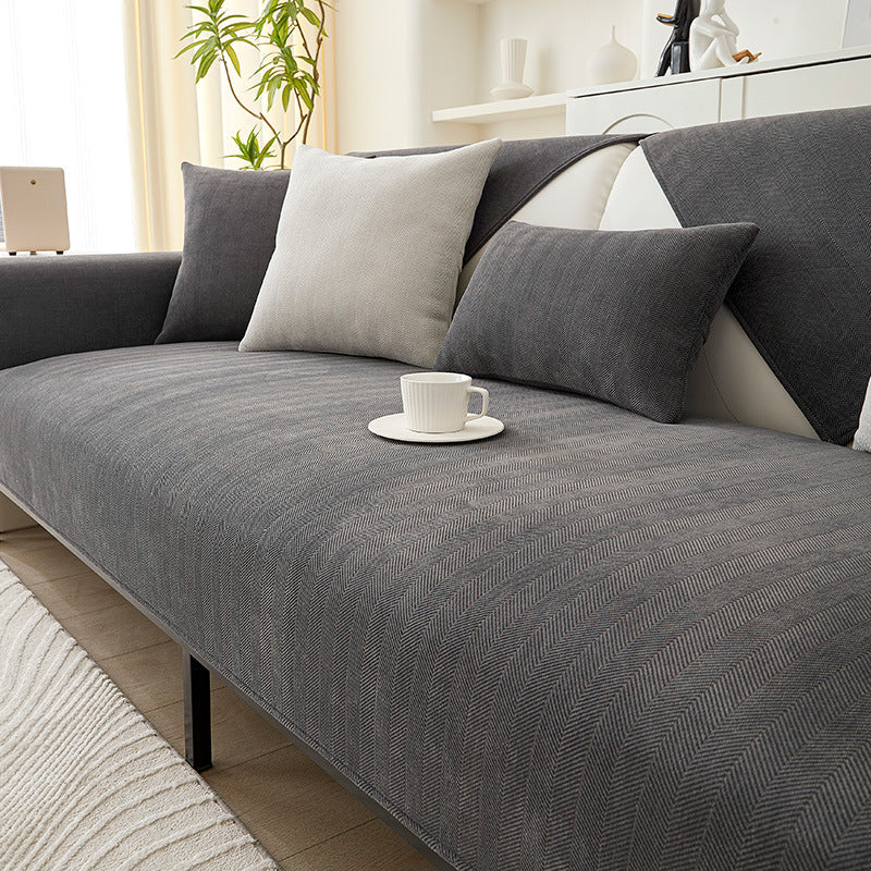 Versatile chenille herringbone sofa protector for various couches. Non-slip and easy to clean.