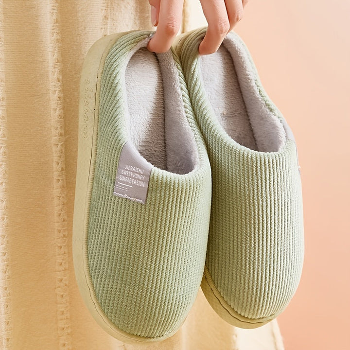 Soft plush women's house slippers, offering cozy warmth and ultimate comfort for relaxing at home.