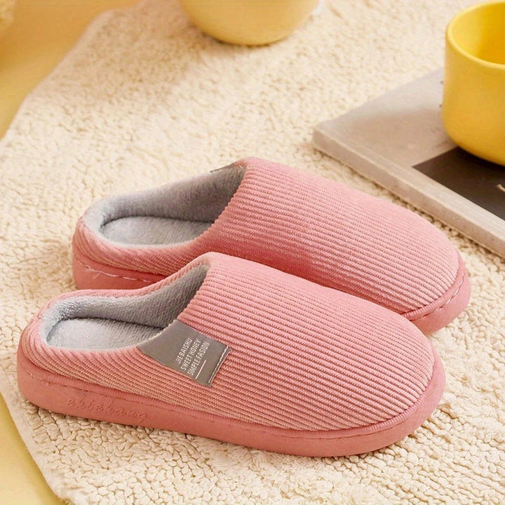 Comfortable indoor women's slippers, ideal for loungewear. These plush house shoes offer cozy, non-slip home comfort.