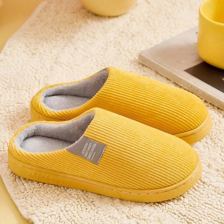 Stylish women's plush slippers in a cozy design, perfect as indoor house shoes for relaxing home comfort.