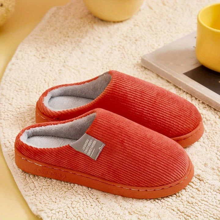 Ultimate comfort women's plush slippers, featuring a soft design for cozy indoor wear and home relaxation.