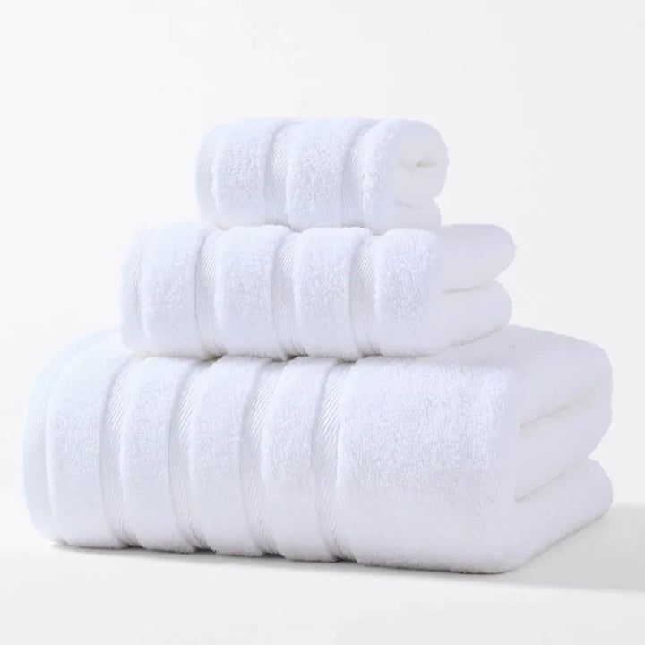 Complete plush cotton bath towel set, soft, absorbent, and quick-drying for any bathroom.