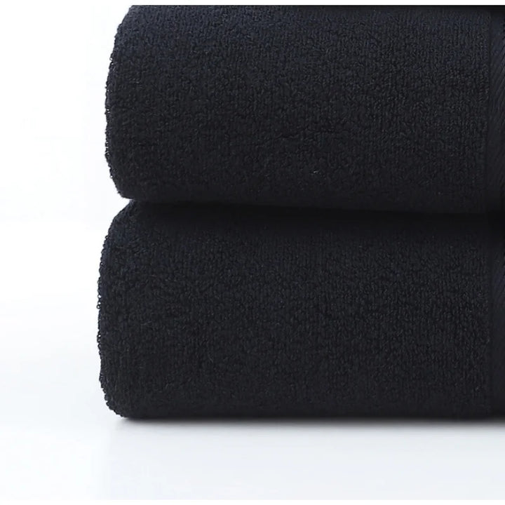 Premium plush cotton bath towel set; durable, soft, and highly absorbent for everyday luxury.