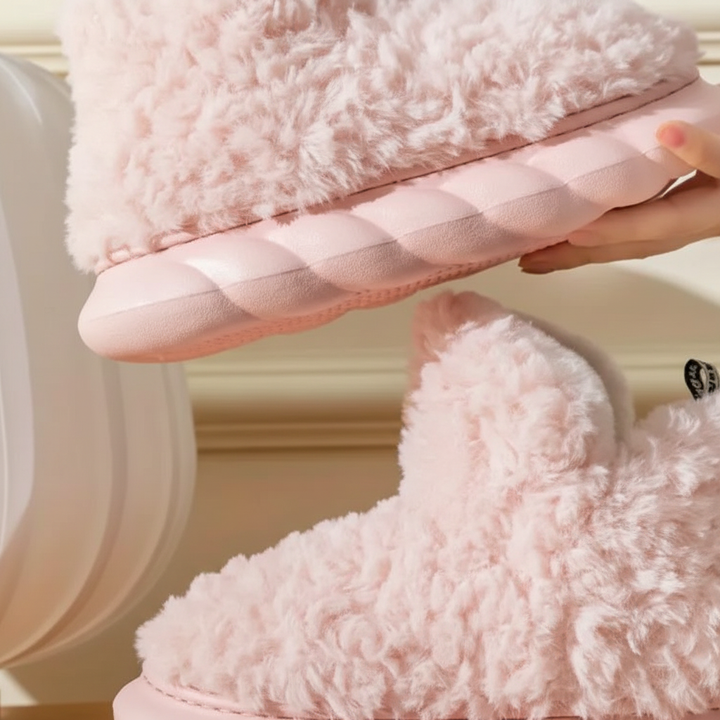 Soft white TeddyEase women's slippers, essential indoor footwear for warmth and relaxation.