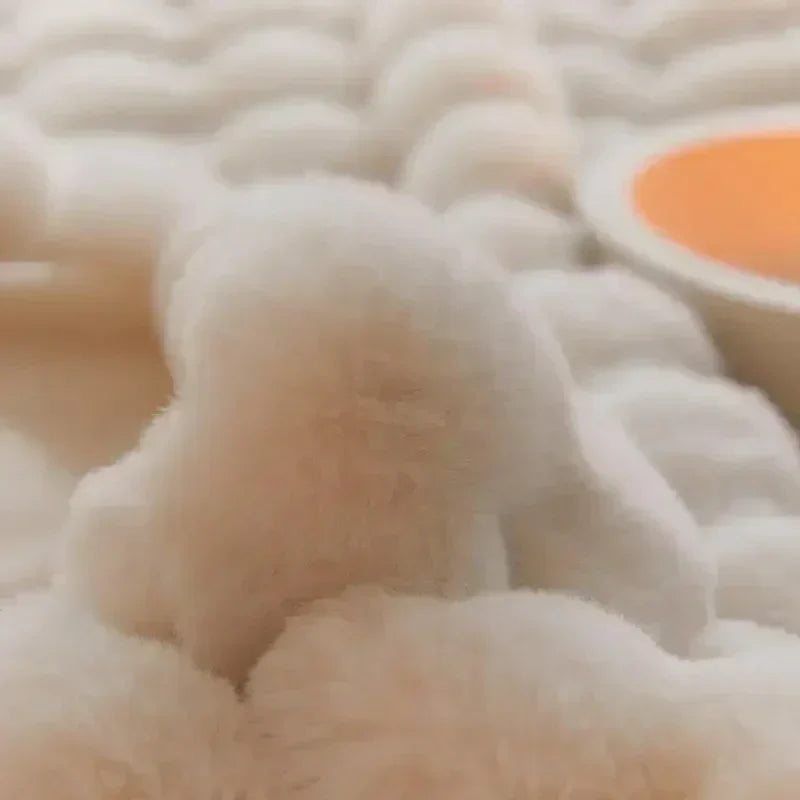 Beautifully draped faux fur blanket, providing a cozy and luxurious feel to home furnishings