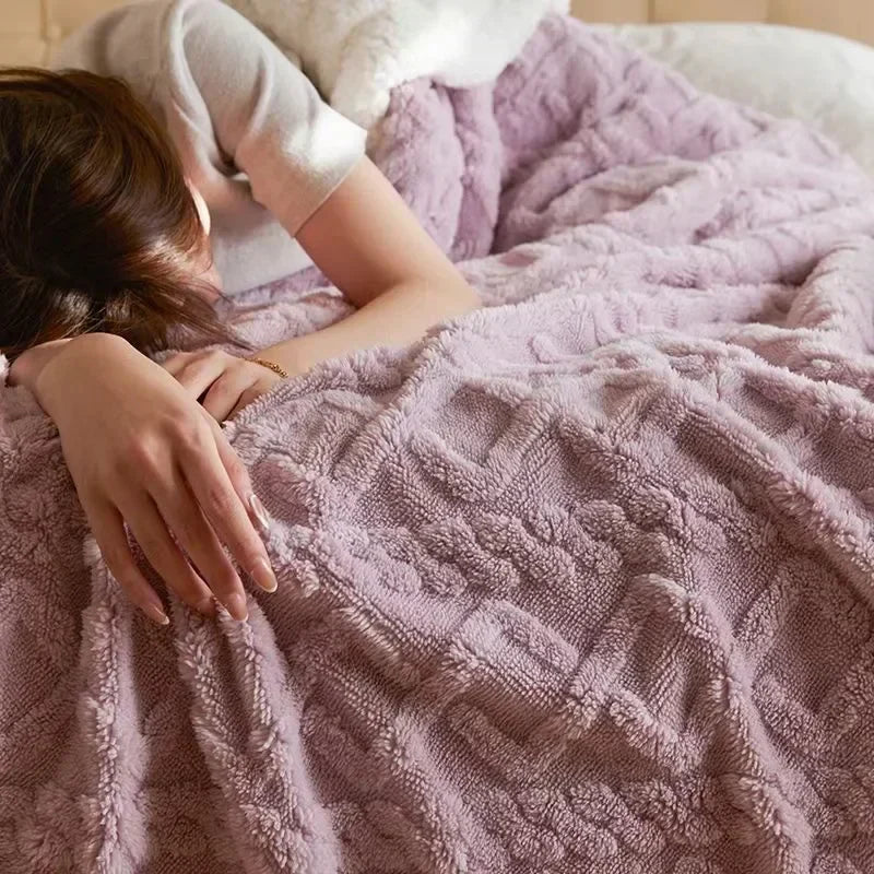 Soft cream-colored double-sided fleece and lambswool blanket, ideal for ultimate warmth and cozy home decor.