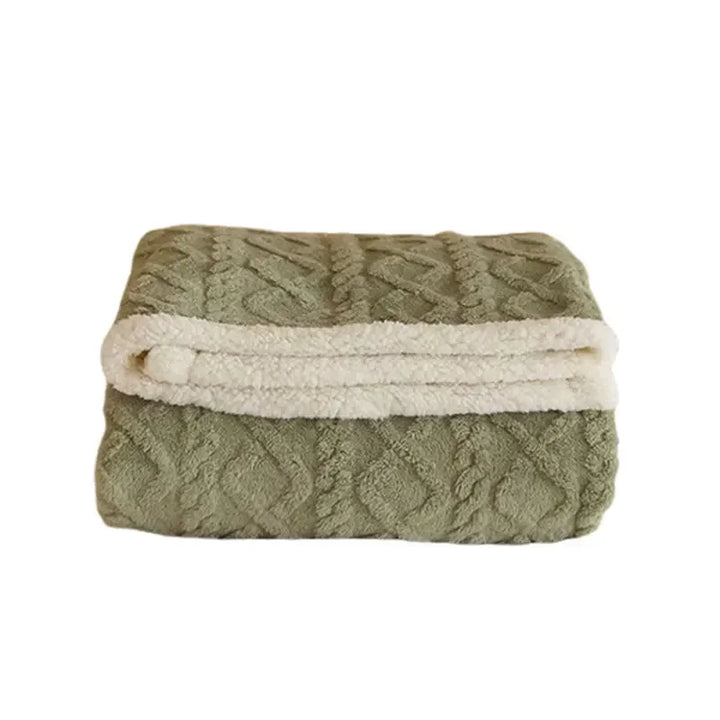 Elegant throw blanket, double-sided with plush fleece and premium lambswool, adding warmth to a living space.