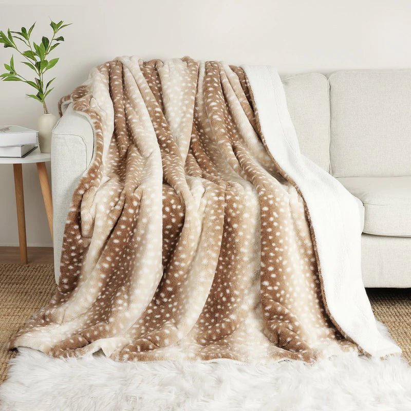 Plush faux fur deer throw blanket, reversible, soft & cozy. Perfect bedroom decor accent.