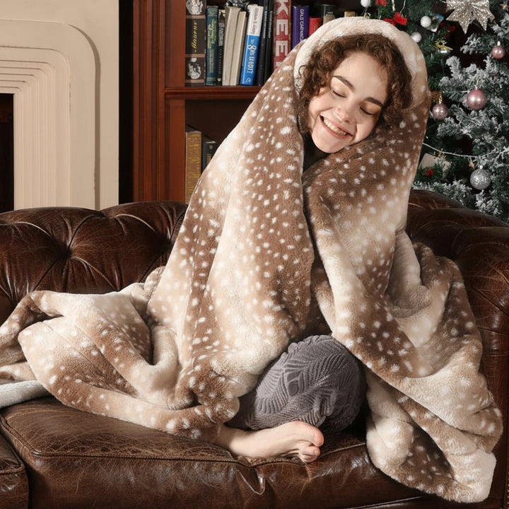 Reversible faux fur throw blanket with realistic deer pattern. Plush polyester for warmth & comfort.