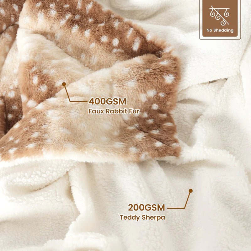 Luxurious faux fur deer throw blanket, plush & reversible. Adds cozy comfort & style to bedroom decor.