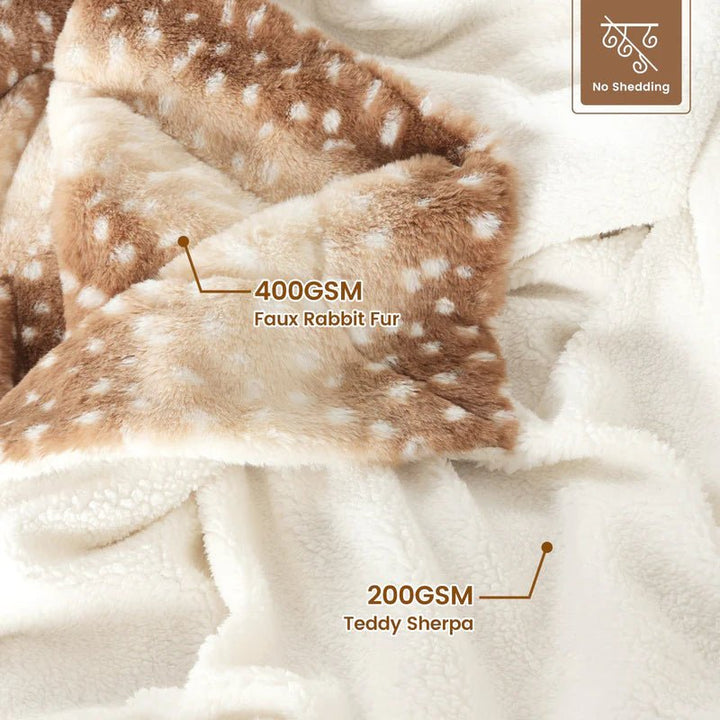 Luxurious faux fur deer throw blanket, plush & reversible. Adds cozy comfort & style to bedroom decor.