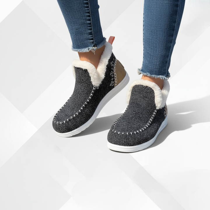 Comfortable women's winter footwear, plush-lined ComfyGlide slippers, perfect for cozy warmth.