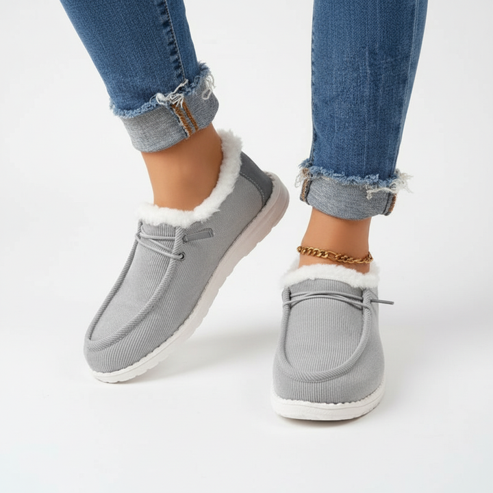 Side view of Elvira women's cozy winter boots, featuring plush lining and slip-on design