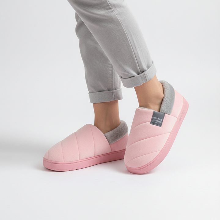 Warm women's fleece slippers in a beige tone, featuring a plush lining for ultimate comfort