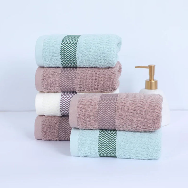 Quick-dry & highly absorbent luxury cotton towel set, soft & durable for modern bathroom decor.