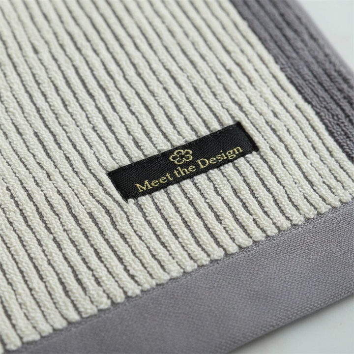 Close-up of a textured bio-cotton spa towel, highlighting its softness and absorbency, perfect for home.