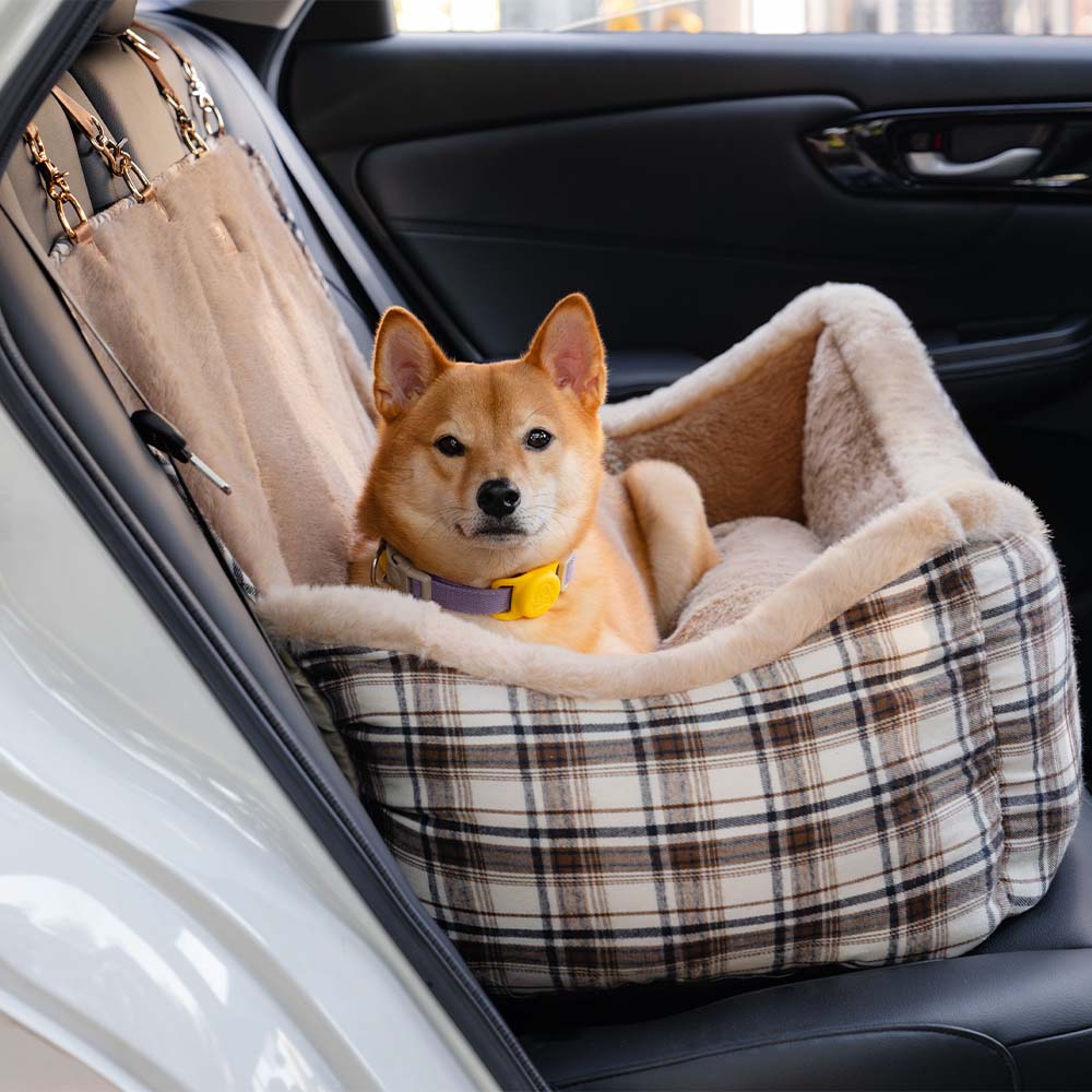 Washable plush car seat for small dogs, offering a secure & comfortable travel bed.