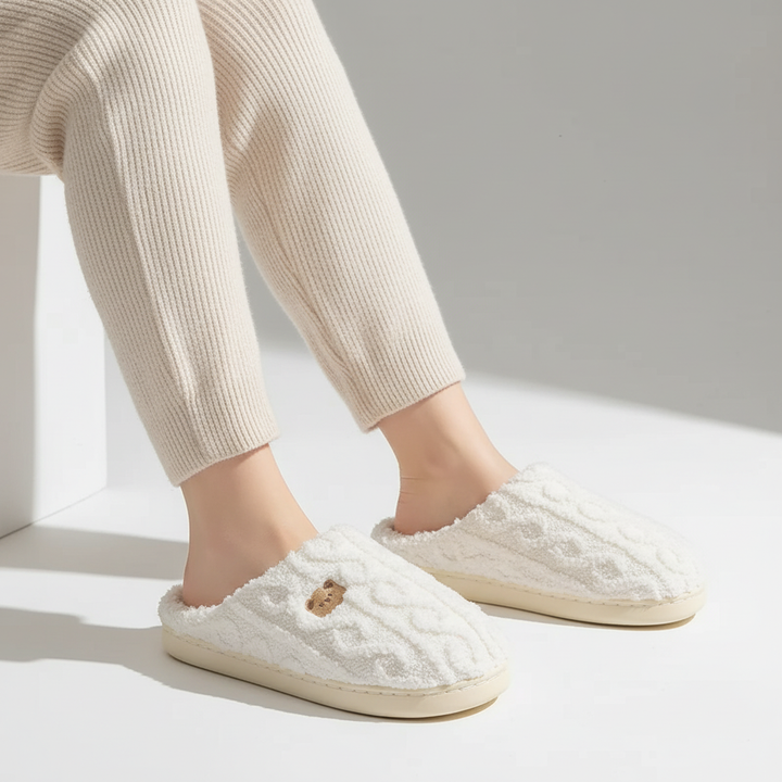 Warm gray women's winter slippers with soft fleece lining and non-slip sole.