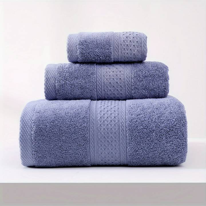 RelaxWrap unisex absorbent cotton bath towel folded neatly on a bed, spa quality at home