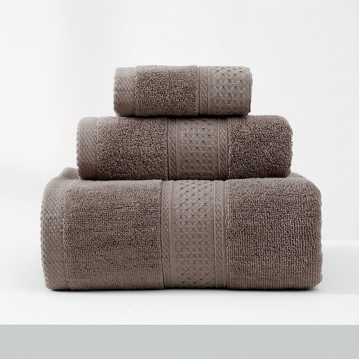 Unisex absorbent cotton bath towel from RelaxWrap draped over a modern bathroom rack
