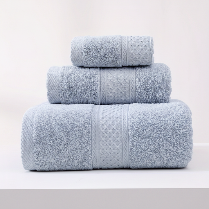 Detail of a RelaxWrap plush absorbent cotton towel's hem, highlighting its durability