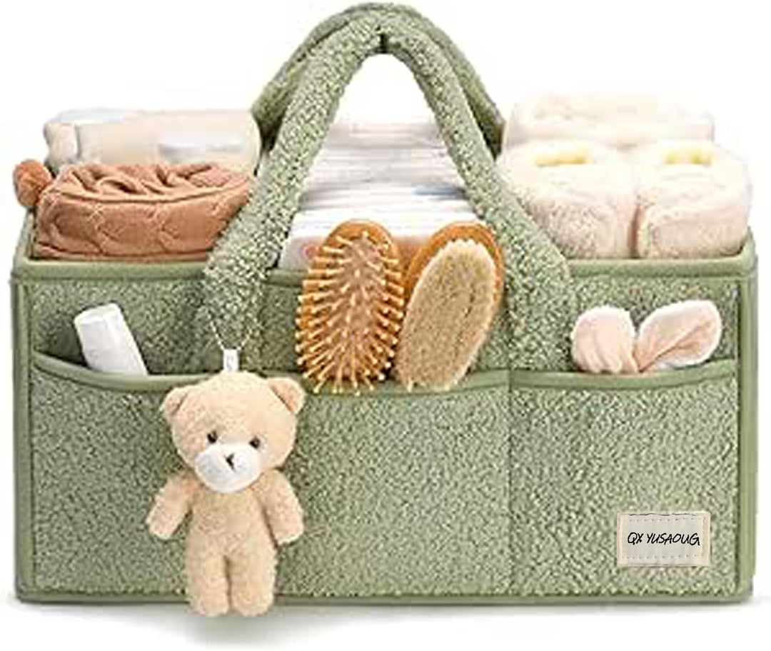 Green sherpa nappy organizer on a changing table, keeping baby supplies within reach