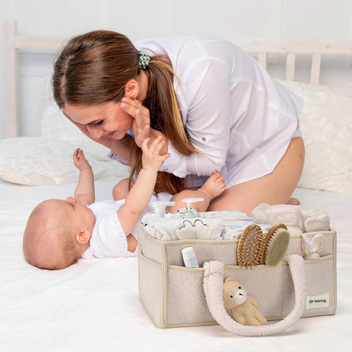 Green sherpa diaper caddy, organized with baby's daily essentials, convenient and neat