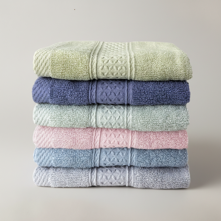 Luxurious five-star hotel bathroom featuring a neatly stacked, rustic style six-piece cotton towel set