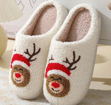 Stylish festive deer winter house slippers. Warm, plush, non-slip, ideal for cozy indoor comfort.