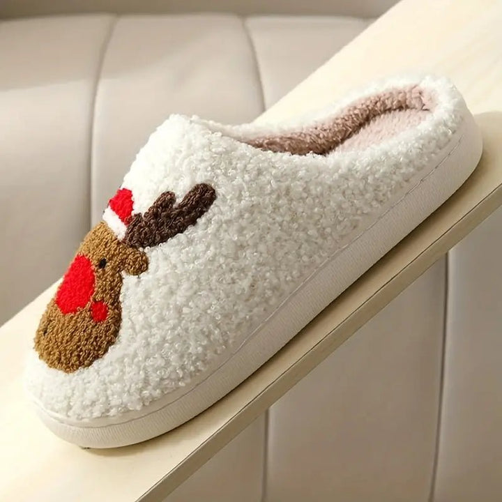 Soft plush winter house slippers with a festive deer motif. Warm, comfortable, & non-slip for indoor wear.
