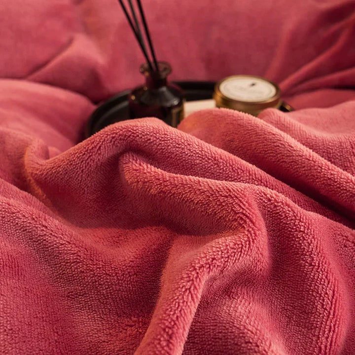 Top-down view of a bed featuring a velvet fleece duvet cover set, showcasing its plush and inviting texture.