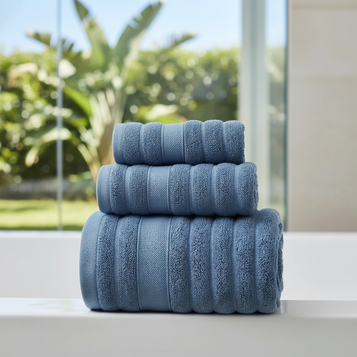 Plush white 100% cotton indulgent towel set, soft and absorbent, perfect for a luxury bathroom experience by CottonDream