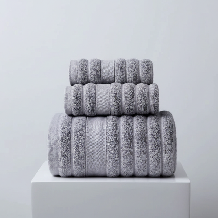 Detail of the woven texture of a pure cotton bath towel from an indulgent set, highlighting its high quality and absorbency