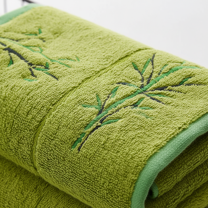 Unisex BambooSoft towel set in a elegant bathroom setting, draped over a rack, suggesting luxury & antibacterial qualities.
