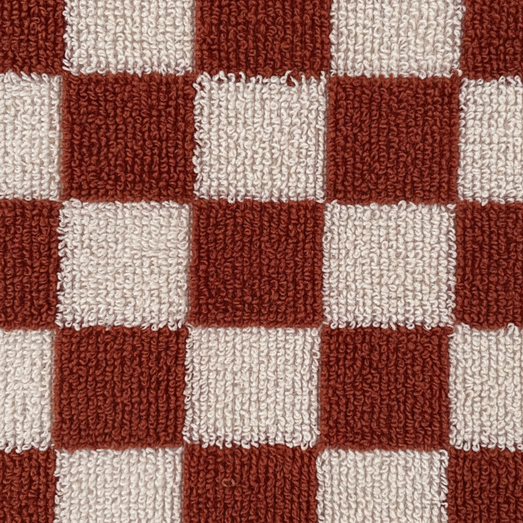 Stacked premium cotton bath towels in a spa setting, emphasizing their softness and easy care properties.