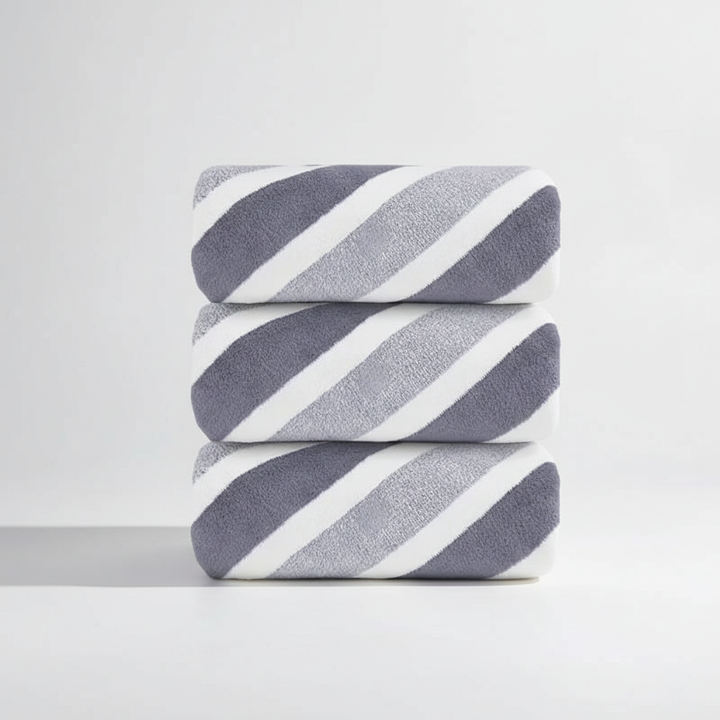 Folded blue fleece washcloth, part of an absorbent towel set, perfect for everyday soft comfort.