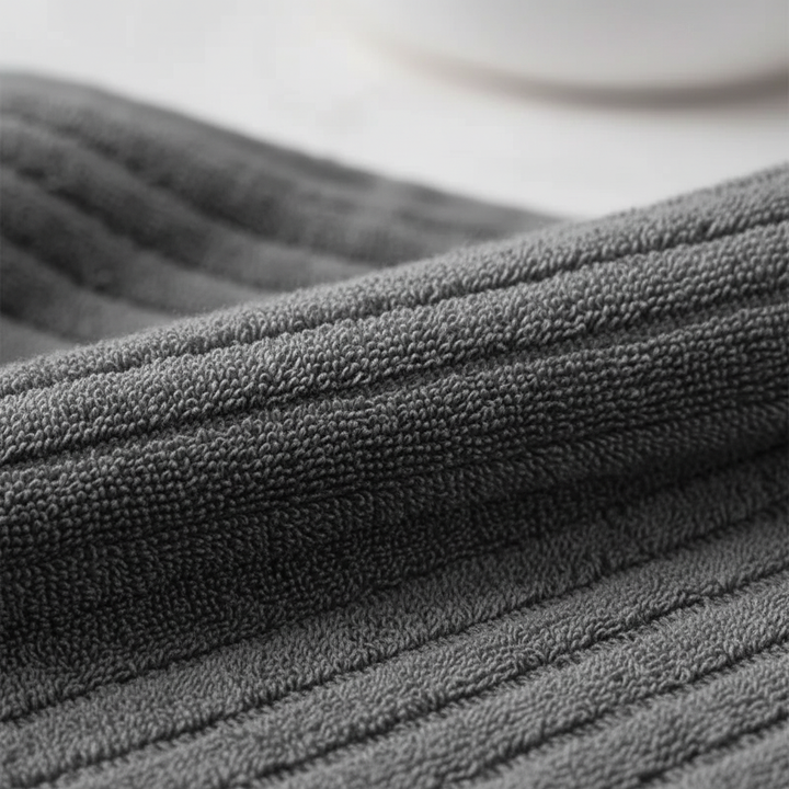 Close-up of fluffy terry cloth texture from a quick-dry bath towel set, soft and absorbent.