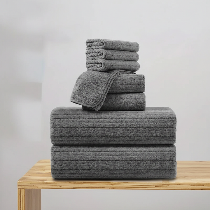 Stack of soft, absorbent quick-dry terry bath towels, ideal for daily use.
