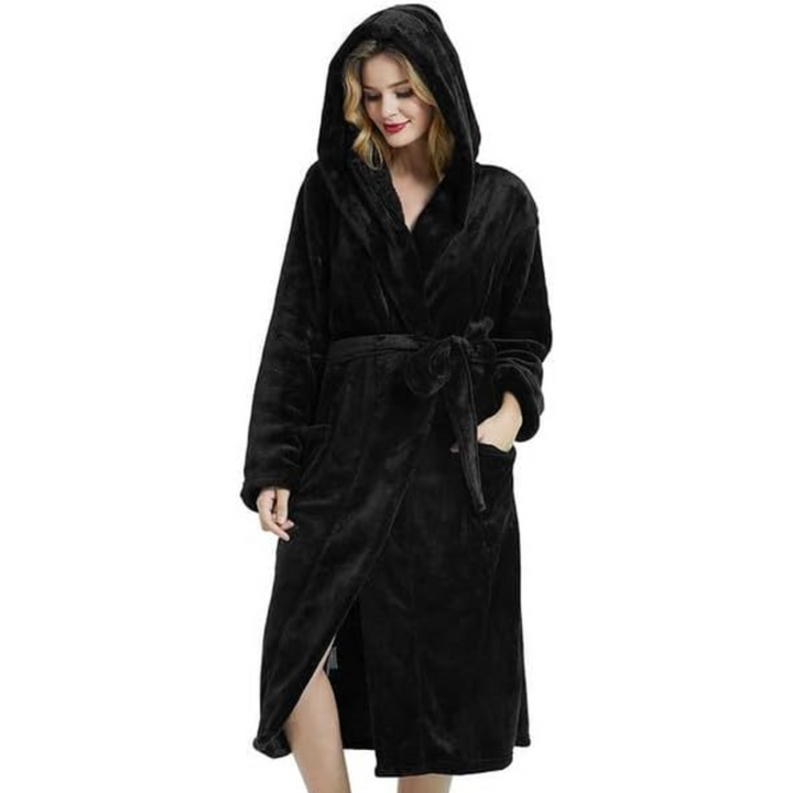 Front view of a woman wearing a plush pink fleece hooded bathrobe, tied at the waist for a snug fit.