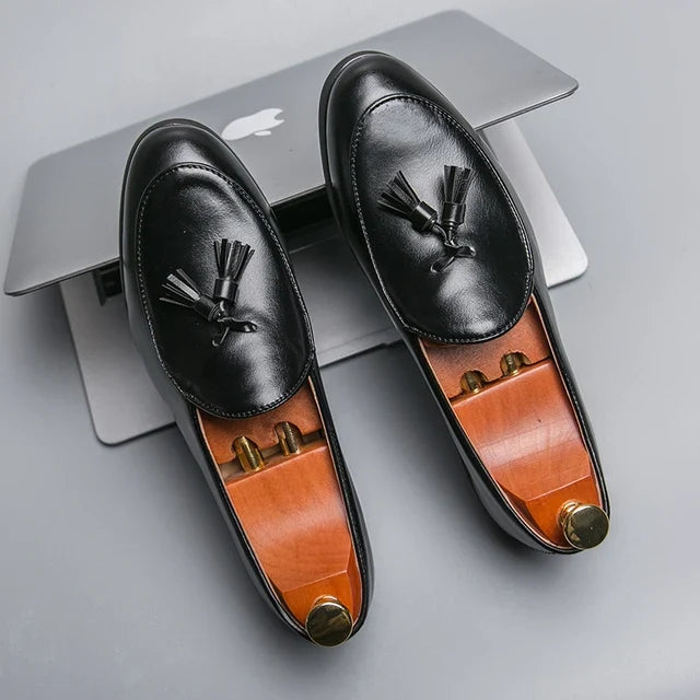 Sophisticated men's black slip-on loafers with tassels, great for dinner shoes & smart casual.