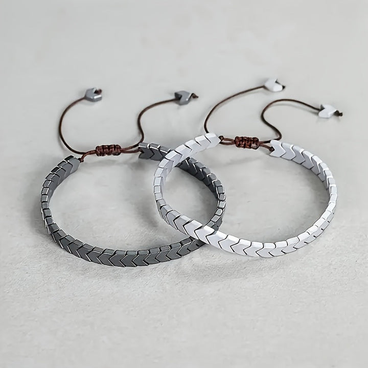 Versatile polished hematite beaded bracelet, unisex natural stone accessory. Adjustable & perfect for layering.