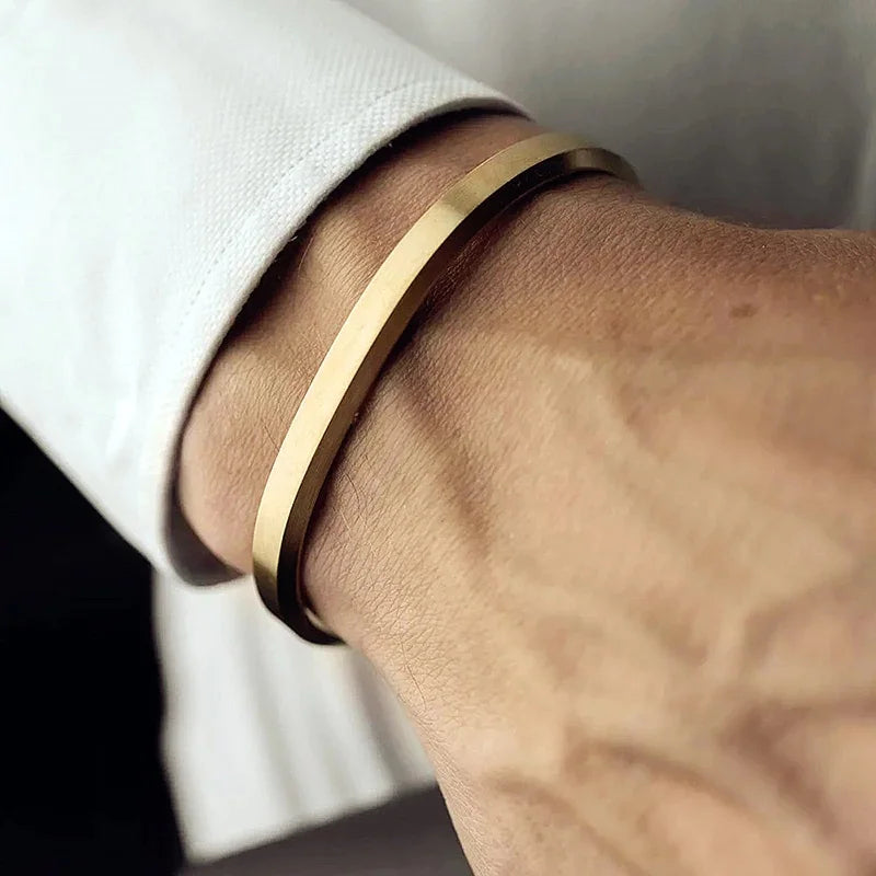 Polished stainless steel minimalist men's cuff bracelet, sleek & modern accessory for him.