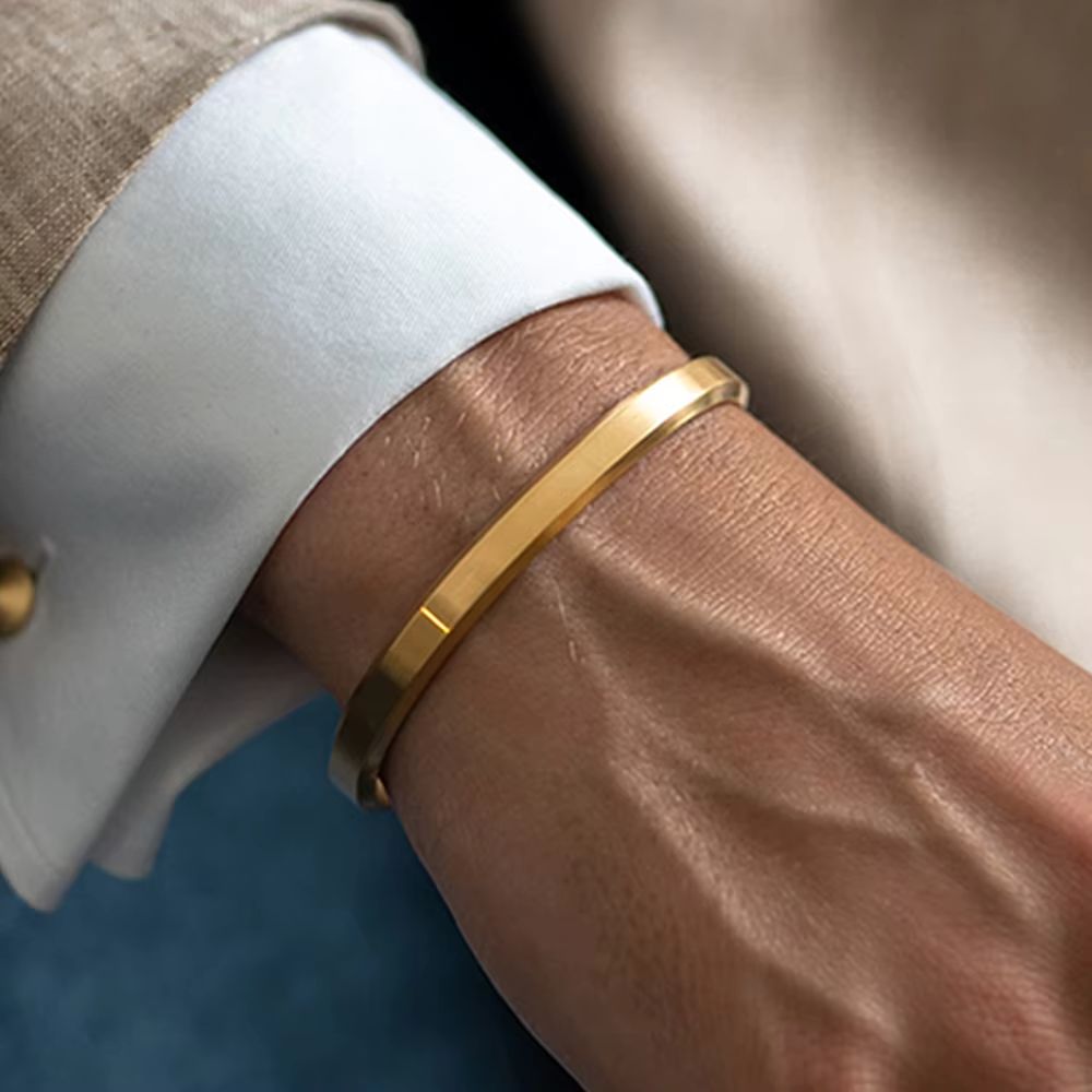Modern men's minimalist cuff bracelet crafted from high-quality polished stainless steel jewelry.
