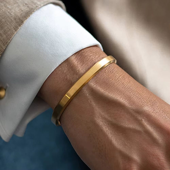 Modern men's minimalist cuff bracelet crafted from high-quality polished stainless steel jewelry.