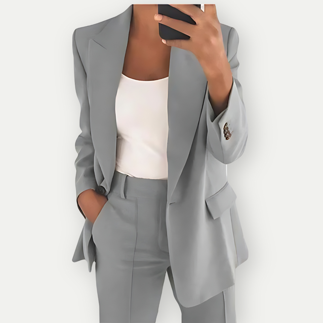 Chic women's tailored blazer suit set. Professional two-piece outfit for elegant office & formal occasions.
