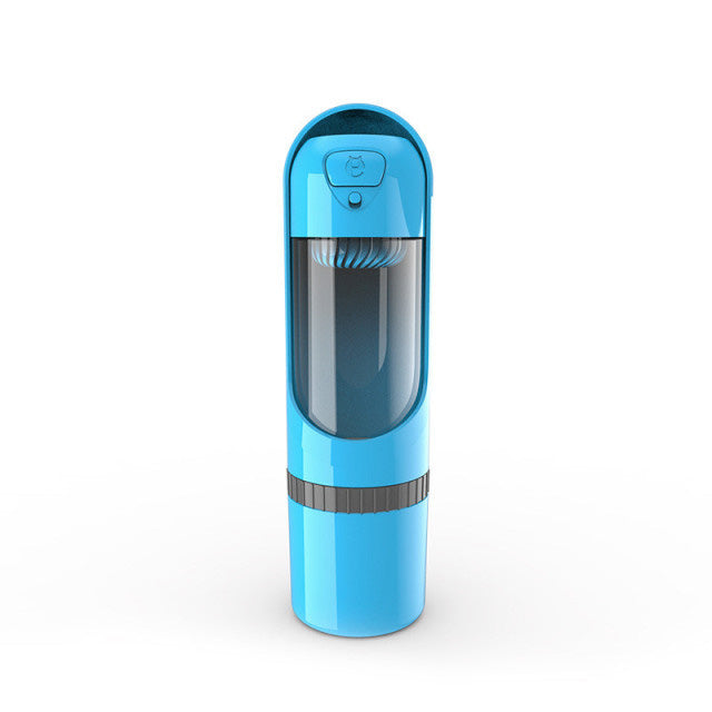 Hand holding the portable dog water & food bottle, ready for an outdoor adventure.